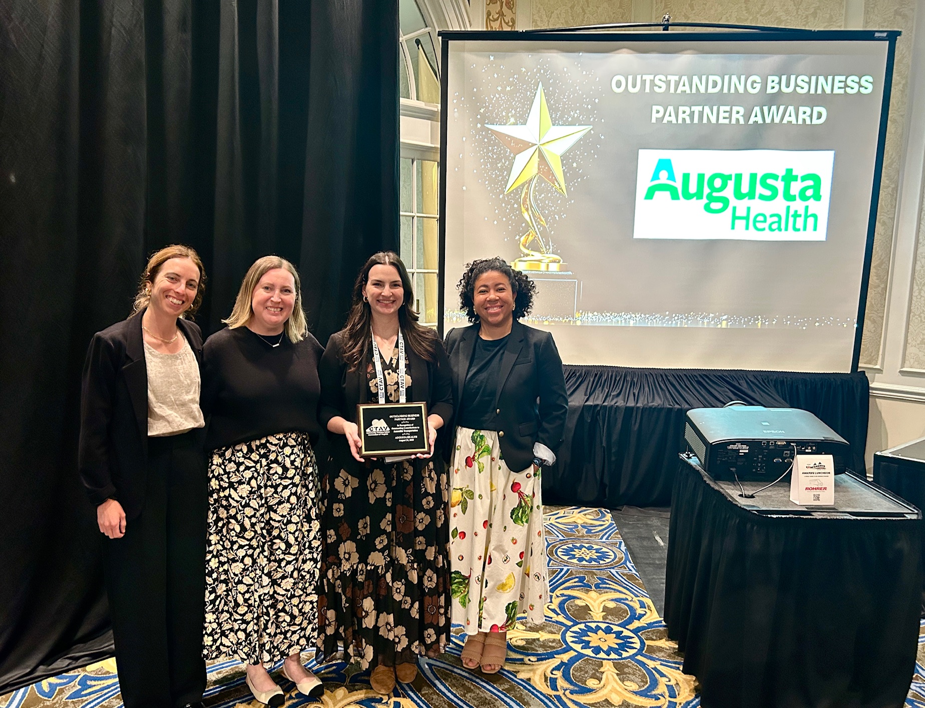 Image of CSPDC and Augusta Health Staff holding an award plaque