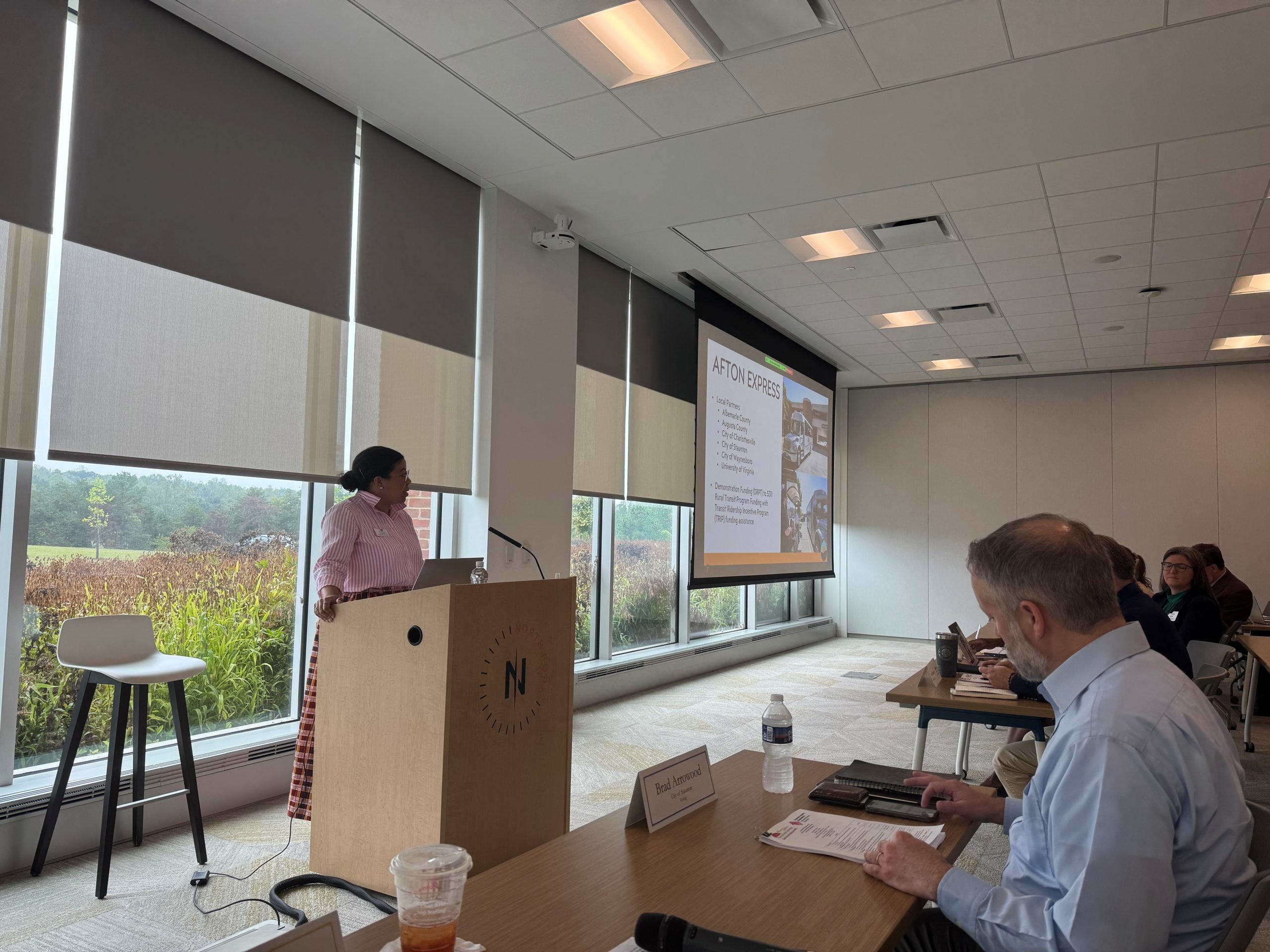 Person at a podium giving a presentation